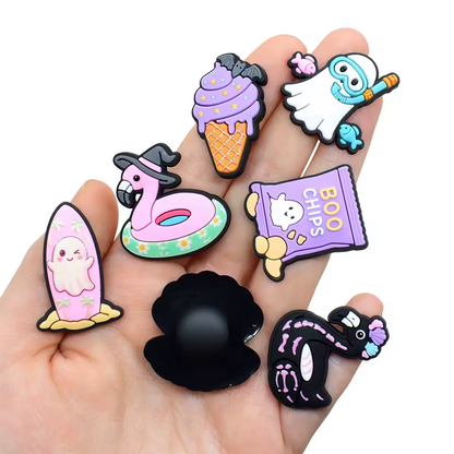 Close-up of assorted cartoon beach and Halloween PVC shoe charms