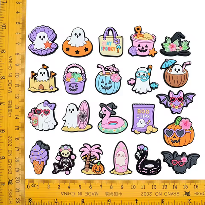 Assorted cartoon beach and Halloween PVC shoe charms with size reference