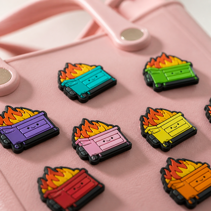 Close-up detail image showing material and finish of custom rubber bag charms on a soft pink tote bag