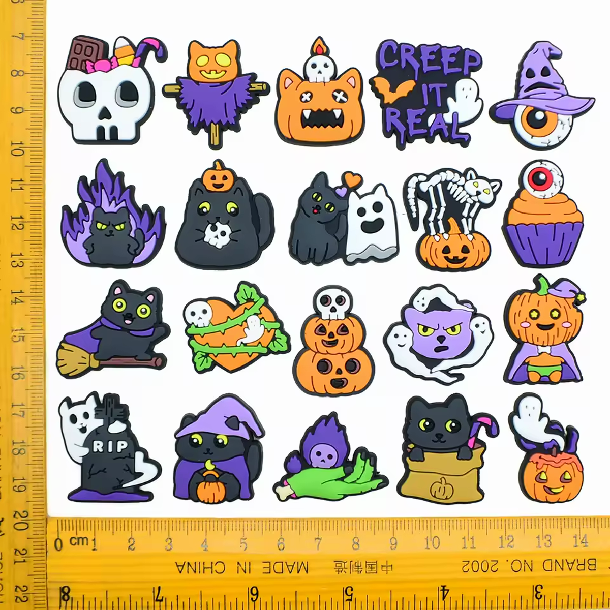Assorted scary Halloween PVC shoe charms with size reference