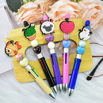Assorted colorful beaded pens with animal toppers